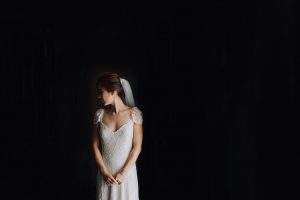 bride in window light at her wedding in borneo