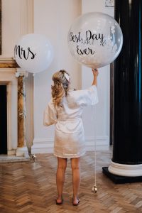 Bride with decorative balloon getting ready at The Ned