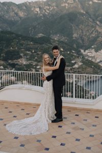 bride and groom on the rooftop of Villa Eva with the view of the Amalfi Coast