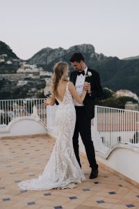 bride and groom on the rooftop of Villa Eva with the view of the Amalfi Coast
