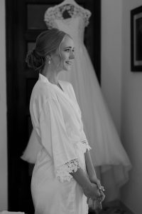 bride posing in front of her wedding dress at Villa Eva, Ravello, Italy