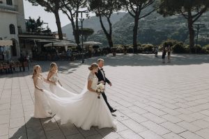 Bride walking with her dad through Ravello, Italy